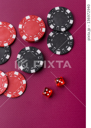 Casino dice and chips on a colored background, poker, gambling with bets. Dice and chips Casino dice and chips on a colored background, poker, gambling with bets. Dice and chips 136972940
