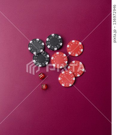Casino dice and chips on a colored background, poker, gambling with bets. Dice and chips Casino dice and chips on a colored background, poker, gambling with bets. Dice and chips 136972946