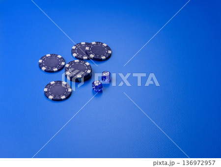 Casino dice and chips on a colored background, poker, gambling with bets. Dice and chips Casino dice and chips on a colored background, poker, gambling with bets. Dice and chips 136972957