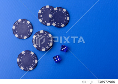 Casino dice and chips on a colored background, poker, gambling with bets. Dice and chips Casino dice and chips on a colored background, poker, gambling with bets. Dice and chips 136972960