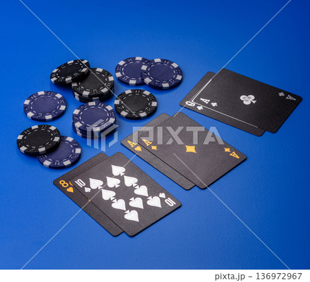 Casino, cards and chips on a colored background, poker and blackjack, gambling. Cards and chips 136972967