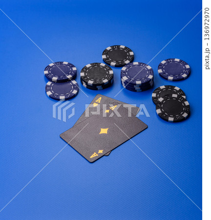 Casino, cards and chips on a colored background, poker and blackjack, gambling. Cards and chips Casino, cards and chips on a colored background, poker and blackjack, gambling. Cards and chips 136972970