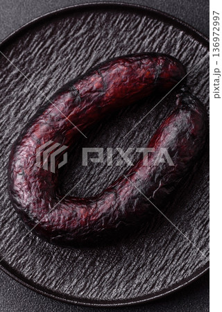 Homemade pork or beef sausage rings with garlic and spices. A homemade sausage ring Homemade pork or beef sausage rings with garlic and spices. A homemade sausage ring 136972997