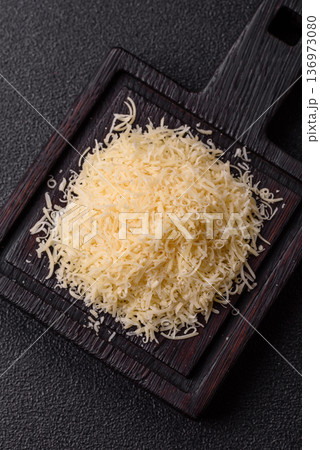 Grated Parmesan cheese as a cooking or baking ingredient. Grated Parmesan cheese Grated Parmesan cheese as a cooking or baking ingredient. Grated Parmesan cheese 136973080