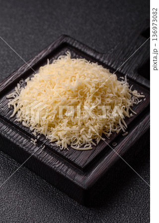 Grated Parmesan cheese as a cooking or baking ingredient. Grated Parmesan cheese Grated Parmesan cheese as a cooking or baking ingredient. Grated Parmesan cheese 136973082