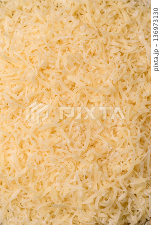 Grated Parmesan cheese as a cooking or baking ingredient. Grated Parmesan cheese Grated Parmesan cheese as a cooking or baking ingredient. Grated Parmesan cheese 136973130