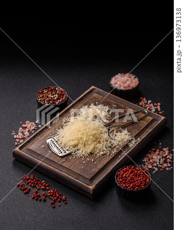 Grated Parmesan cheese as a cooking or baking ingredient. Grated Parmesan cheese Grated Parmesan cheese as a cooking or baking ingredient. Grated Parmesan cheese 136973138