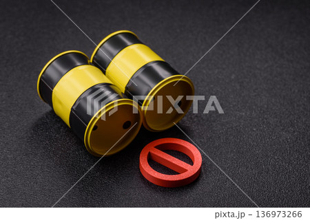 Metal barrels containing oil, gas, or chemicals, with a prohibition sign. Oil barrels Metal barrels containing oil, gas, or chemicals, with a prohibition sign. Oil barrels 136973266