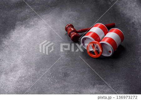 Metal barrels containing oil, gas, or chemicals, with a prohibition sign. Oil barrels Metal barrels containing oil, gas, or chemicals, with a prohibition sign. Oil barrels 136973272