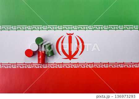 Metal barrels of oil, gas, or chemicals on the Iranian flag, Iran production. Barrels of Iranian oil 136973293