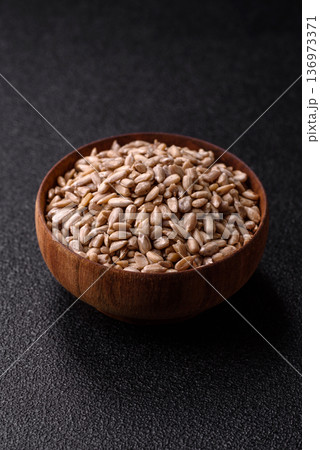 Shelled sunflower seed kernels, salted, roasted, or raw, are a healthy ingredient. Sunflower seeds Shelled sunflower seed kernels, salted, roasted, or raw, are a healthy ingredient. Sunflower seeds 136973371