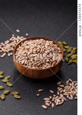 Shelled sunflower seed kernels, salted, roasted, or raw, are a healthy ingredient. Sunflower seeds 136973374