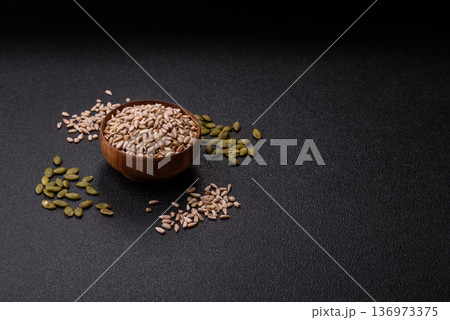 Shelled sunflower seed kernels, salted, roasted, or raw, are a healthy ingredient. Sunflower seeds 136973375