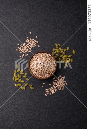 Shelled sunflower seed kernels, salted, roasted, or raw, are a healthy ingredient. Sunflower seeds 136973376