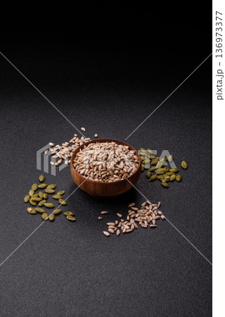 Shelled sunflower seed kernels, salted, roasted, or raw, are a healthy ingredient. Sunflower seeds 136973377