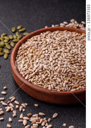 Shelled sunflower seed kernels, salted, roasted, or raw, are a healthy ingredient. Sunflower seeds 136973383