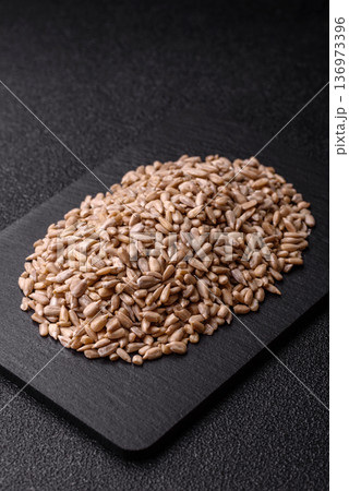 Shelled sunflower seed kernels, salted, roasted, or raw, are a healthy ingredient. Sunflower seeds Shelled sunflower seed kernels, salted, roasted, or raw, are a healthy ingredient. Sunflower seeds 136973396
