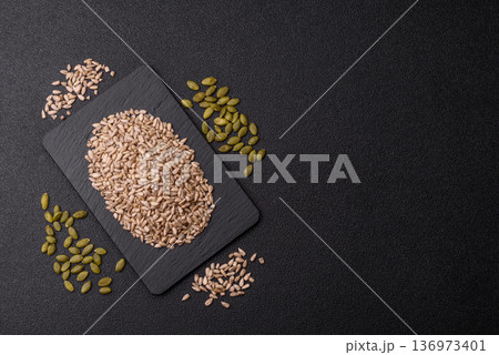 Shelled sunflower seed kernels, salted, roasted, or raw, are a healthy ingredient. Sunflower seeds 136973401