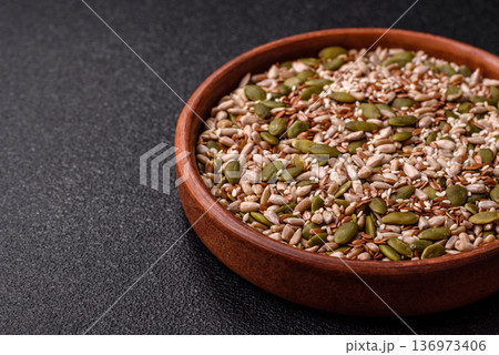 Shelled sunflower, sesame, pumpkin, and flaxseed kernels as ingredients for healthy food 136973406
