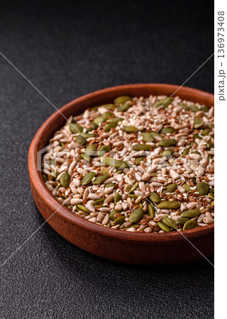 Shelled sunflower, sesame, pumpkin, and flaxseed kernels as ingredients for healthy food 136973408