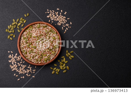 Shelled sunflower, sesame, pumpkin, and flaxseed kernels as ingredients for healthy food 136973413