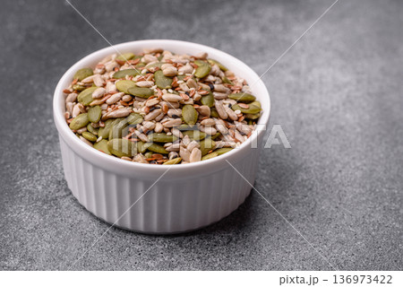 Shelled sunflower, sesame, pumpkin, and flaxseed kernels as ingredients for healthy food 136973422
