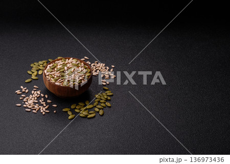 Shelled sunflower, sesame, pumpkin, and flaxseed kernels as ingredients for healthy food 136973436