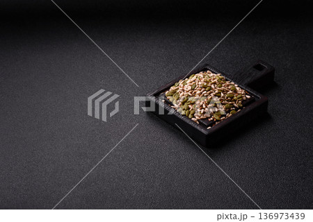 Shelled sunflower, sesame, pumpkin, and flaxseed kernels as ingredients for healthy food Shelled sunflower, sesame, pumpkin, and flaxseed kernels as ingredients for healthy food 136973439