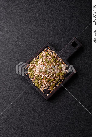 Shelled sunflower, sesame, pumpkin, and flaxseed kernels as ingredients for healthy food 136973440