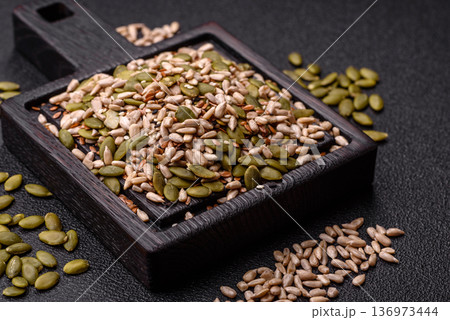 Shelled sunflower, sesame, pumpkin, and flaxseed kernels as ingredients for healthy food Shelled sunflower, sesame, pumpkin, and flaxseed kernels as ingredients for healthy food 136973444