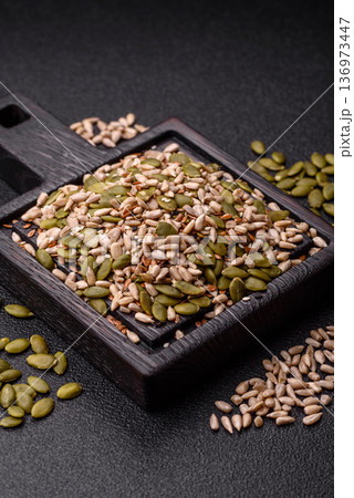 Shelled sunflower, sesame, pumpkin, and flaxseed kernels as ingredients for healthy food Shelled sunflower, sesame, pumpkin, and flaxseed kernels as ingredients for healthy food 136973447