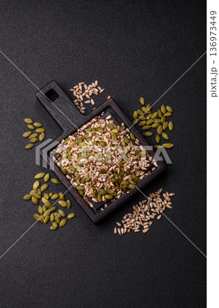 Shelled sunflower, sesame, pumpkin, and flaxseed kernels as ingredients for healthy food 136973449