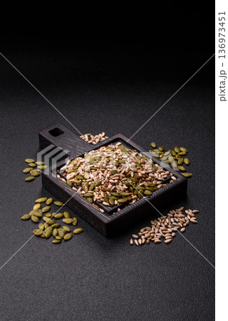 Shelled sunflower, sesame, pumpkin, and flaxseed kernels as ingredients for healthy food Shelled sunflower, sesame, pumpkin, and flaxseed kernels as ingredients for healthy food 136973451