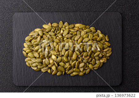 Shelled pumpkin seed kernels, salted, roasted, or raw, are a healthy ingredient. Pumpkin seeds Shelled pumpkin seed kernels, salted, roasted, or raw, are a healthy ingredient. Pumpkin seeds 136973622