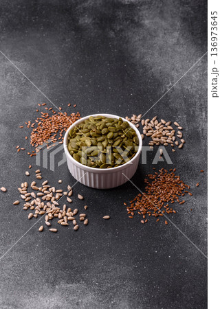 Shelled pumpkin seed kernels, salted, roasted, or raw, are a healthy ingredient. Pumpkin seeds 136973645