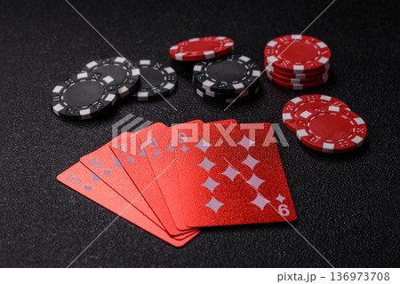 Casino, cards and chips on a colored background, poker and blackjack. Cards and chips Casino, cards and chips on a colored background, poker and blackjack. Cards and chips 136973708