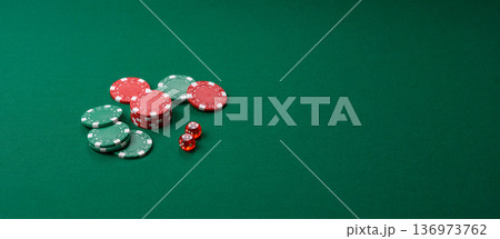 Casino dice and chips on a colored background, poker, gambling with bets. Dice and chips Casino dice and chips on a colored background, poker, gambling with bets. Dice and chips 136973762