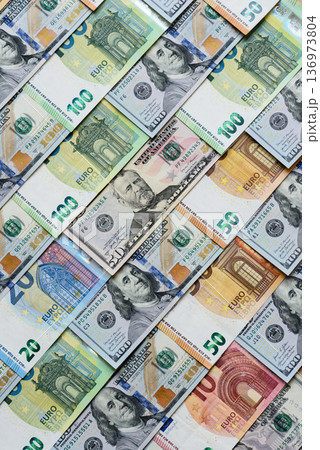 Euro and dollar banknotes, exchange, sales, economic tariffs and taxes. Euros and dollars 136973804