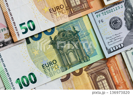 Euro and dollar banknotes, exchange, sales, economic tariffs and taxes. Euros and dollars 136973820