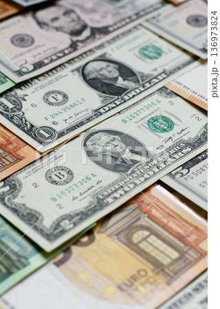 Euro and dollar banknotes, exchange, sales, economic tariffs and taxes. Euros and dollars Euro and dollar banknotes, exchange, sales, economic tariffs and taxes. Euros and dollars 136973824