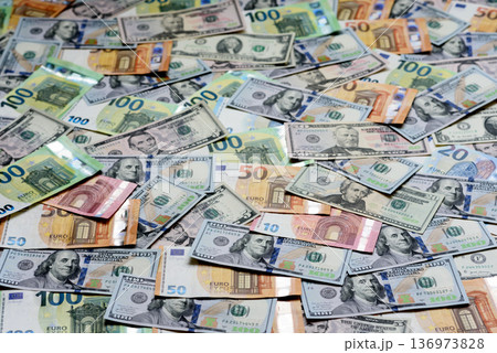 Euro and dollar banknotes, exchange, sales, economic tariffs and taxes. Euros and dollars 136973828