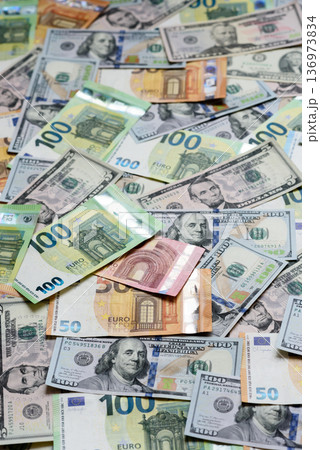 Euro and dollar banknotes, exchange, sales, economic tariffs and taxes. Euros and dollars Euro and dollar banknotes, exchange, sales, economic tariffs and taxes. Euros and dollars 136973834