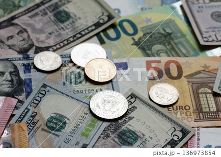 Euro and dollar banknotes, exchange, sales, economic tariffs and taxes. Euros and dollars Euro and dollar banknotes, exchange, sales, economic tariffs and taxes. Euros and dollars 136973854