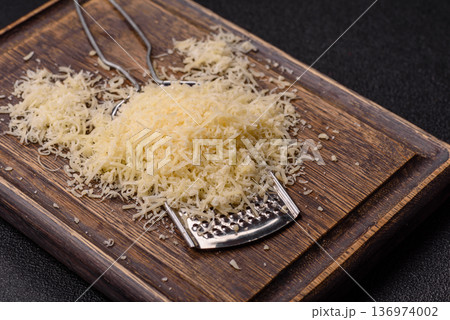Grated Parmesan cheese as a cooking or baking ingredient. Grated Parmesan cheese 136974002