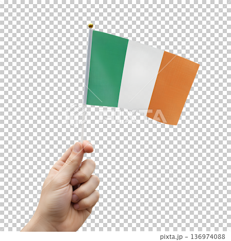 Hand holding a small irish flag on a transparent background. Perfect for st. patrick's day celebrations, irish pride, and cultural events 136974088