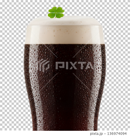 Frosty pint glass of dark stout beer with a foamy head topped with a green shamrock, perfect for st. patrick's day pub celebrations Frosty pint glass of dark stout beer with a foamy head topped with a green shamrock, perfect for st. patrick's day pub celebrations 136974094