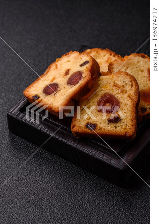 Fruit cake, a dessert with cherries, plums, and raisins for a festive Christmas table. Fruit cake 136974217