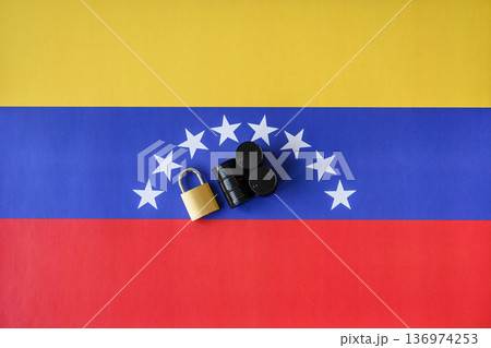 Barrels of oil, gas, or chemicals on the venezuelan flag and a ban sign. Barrels of venezuela oil Barrels of oil, gas, or chemicals on the venezuelan flag and a ban sign. Barrels of venezuela oil 136974253