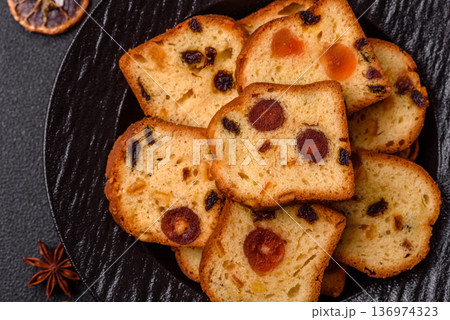 Fruit cake, a dessert with cherries, plums, and raisins for a festive Christmas table. Fruit cake 136974323