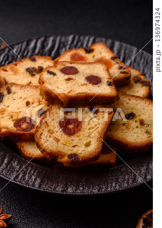 Fruit cake, a dessert with cherries, plums, and raisins for a festive Christmas table. Fruit cake 136974324